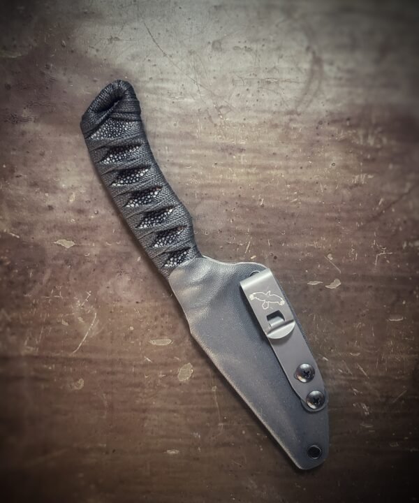 DE Anathema with polished stingray and black wrap in sheath