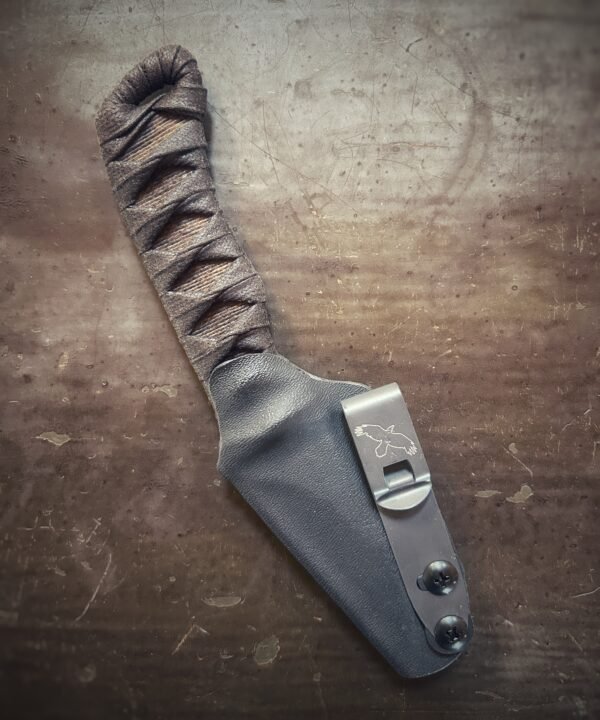 Corax with brown wrap over burnt jute in sheath.