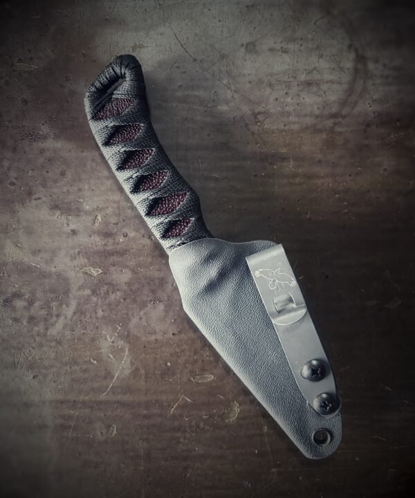 Wizard Finger with satin grind and oxblood stingray and black wrap in sheath