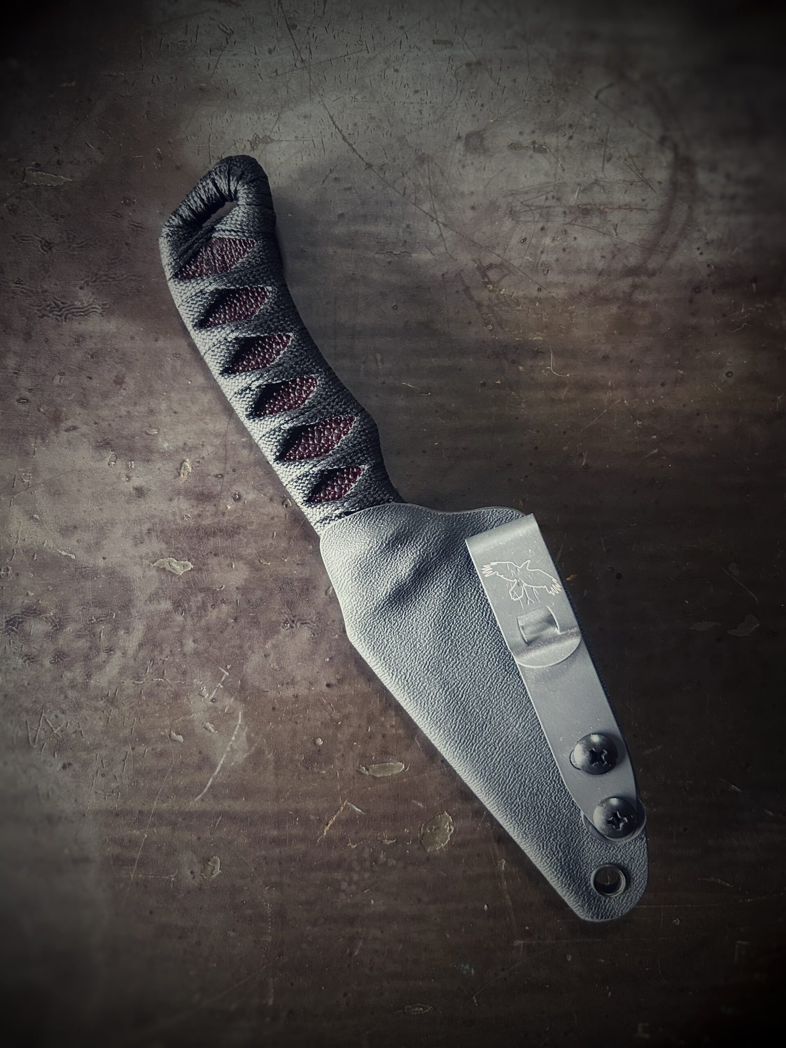Wizard Finger with satin grind and oxblood stingray and black wrap in sheath