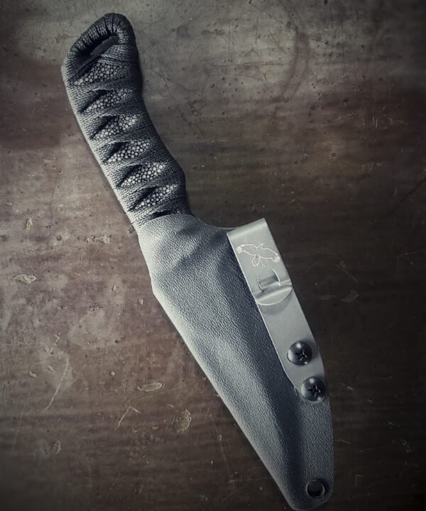 DE Erinyes with colorful heat treat blade and polished stingray and black wrap in sheath