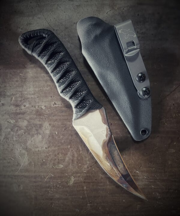 DE Erinyes with colorful heat treat blade and polished stingray and black wrap with sheath