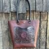 Sweetwater tote, black and oxblood western floral with oxblood stingray inset.