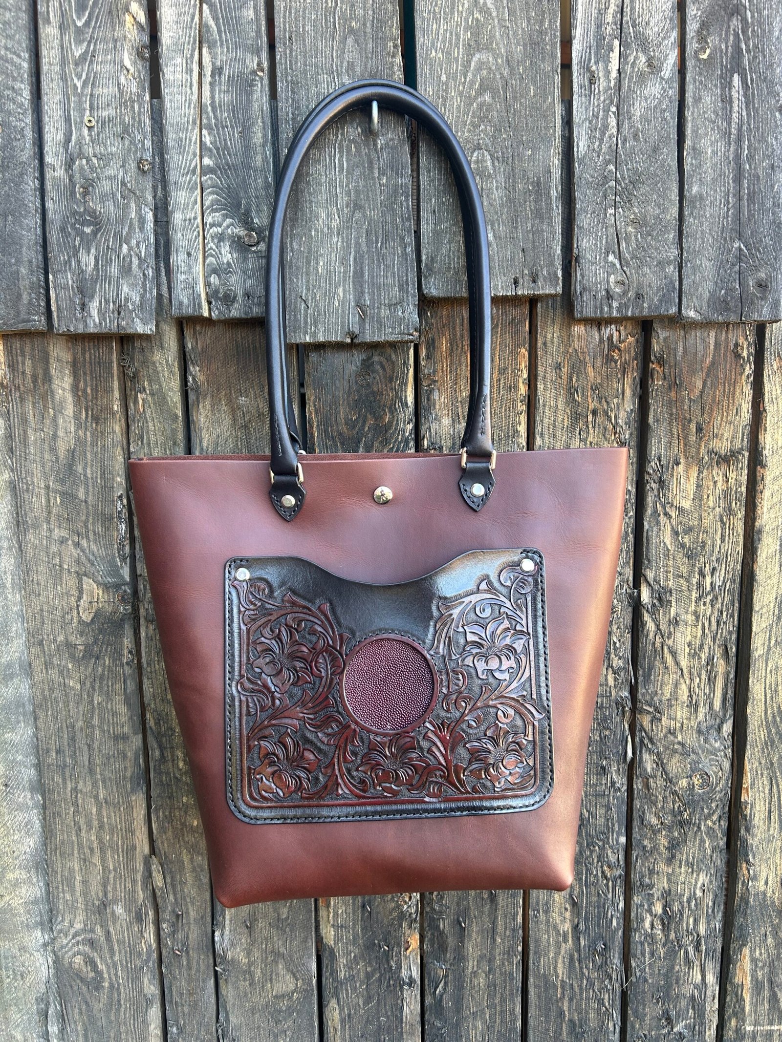 Sweetwater tote, black and oxblood western floral with oxblood stingray inset.