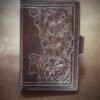 Notebook with 3 flowers in a Western floral design on a black background