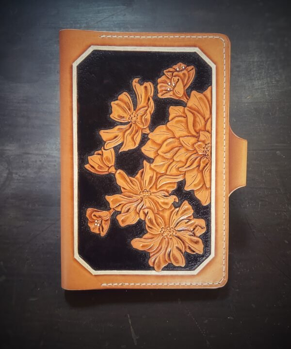 Notebook with modern botanical carving. black and tan with a white background