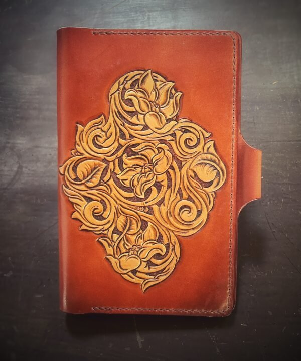 Notebook with 3 flowers in a Western floral design on a brown background