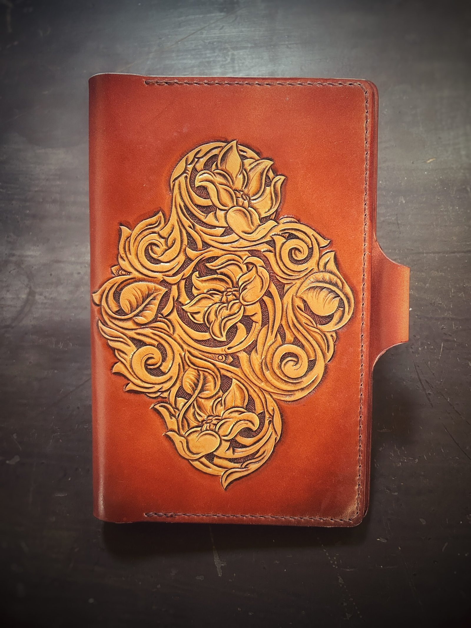 Notebook with 3 flowers in a Western floral design on a brown background