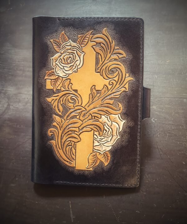 Notebook, 2 white roses and a cross on a black background
