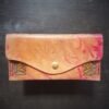 Madison wallet exterior, 2 sunflowers with a rainbow marbled background