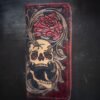 Boulder wallet exterior, red and black marbled background with skull, rose, western scroll work on right side
