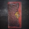 Boulder wallet exterior, brown basketweave background and turquoise accents with 2 sunflowers