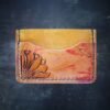 Granite wallet, sunflower on left side with background in yellow and yellow and red marbling accents