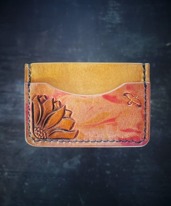 Granite wallet, sunflower on left side with background in yellow and yellow and red marbling accents