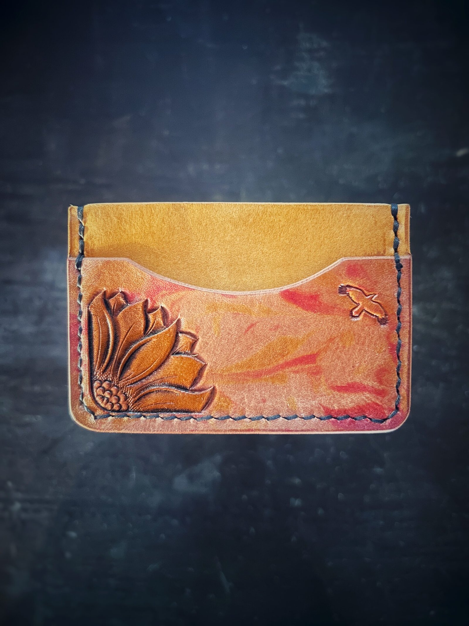 Granite wallet, sunflower on left side with background in yellow and yellow and red marbling accents