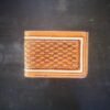 Mission wallet, natural tan and brown basketweave and a white boarder.