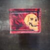Mission wallet, red and black marbling and a skull with black boarder.