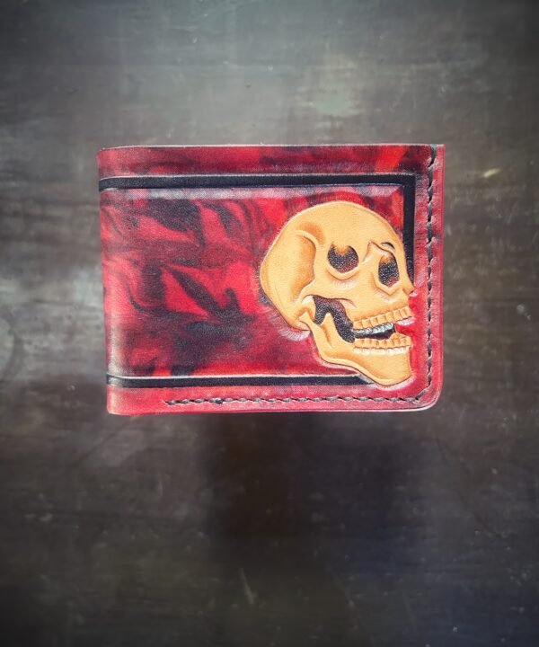 Mission wallet, red and black marbling and a skull with black boarder.