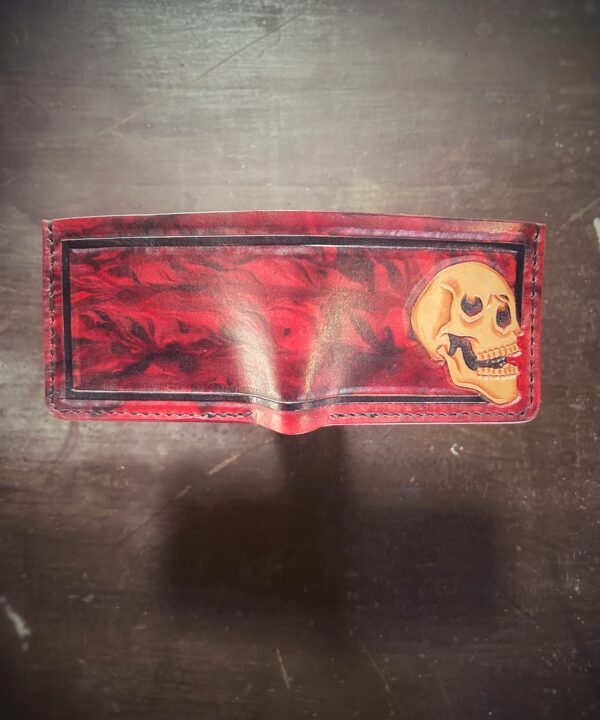Mission wallet, red and black marbling and a skull with black boarder.