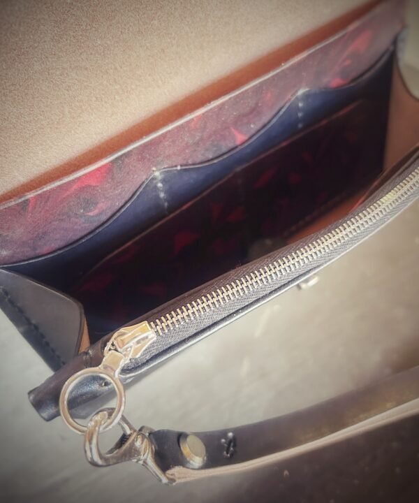 Bitterroot Wallet interior, red and black marbling and silver hardware