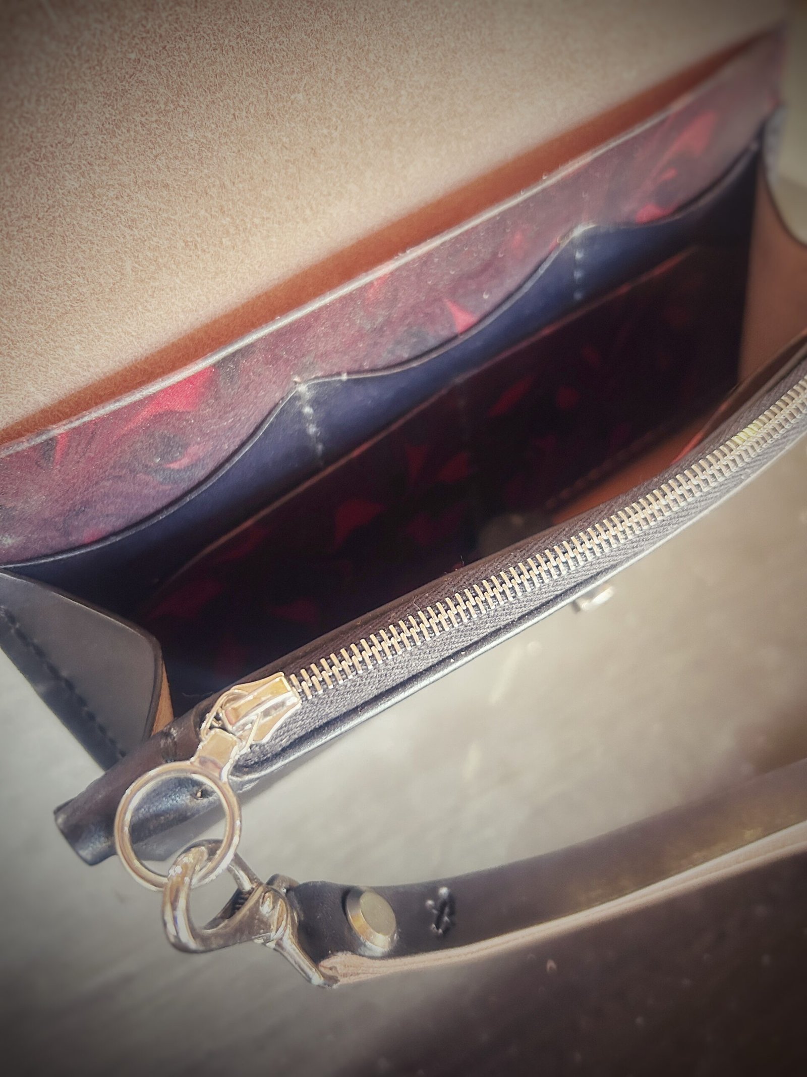 Bitterroot Wallet interior, red and black marbling and silver hardware