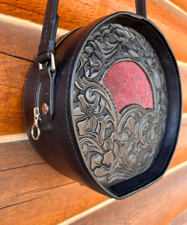 Yellowstone round bag, black western floral with red stingray inset.