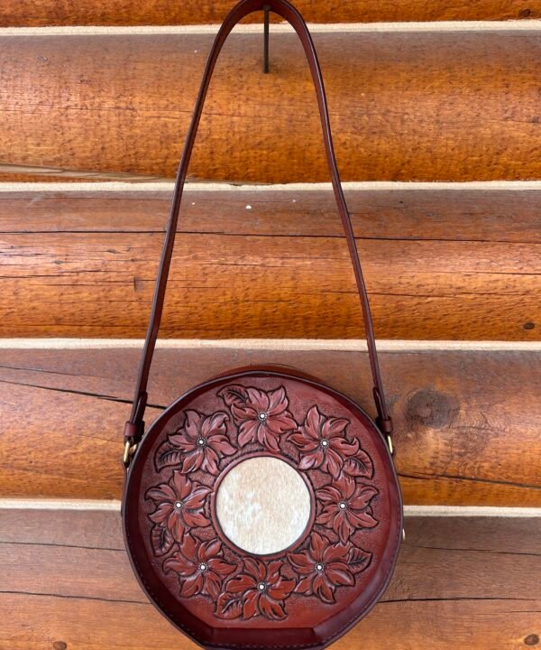 Yellowstone round bag, brown floral with tan and cream hair on hide inset.